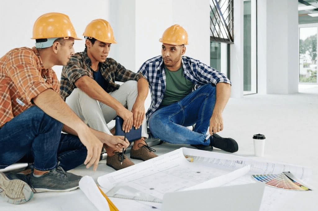 Spray foam insulation professionals discussing renovation plans